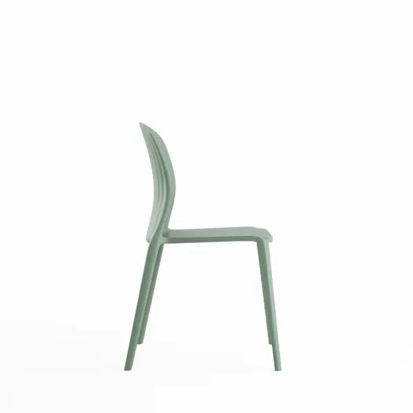 Side view of a sage green plastic chair