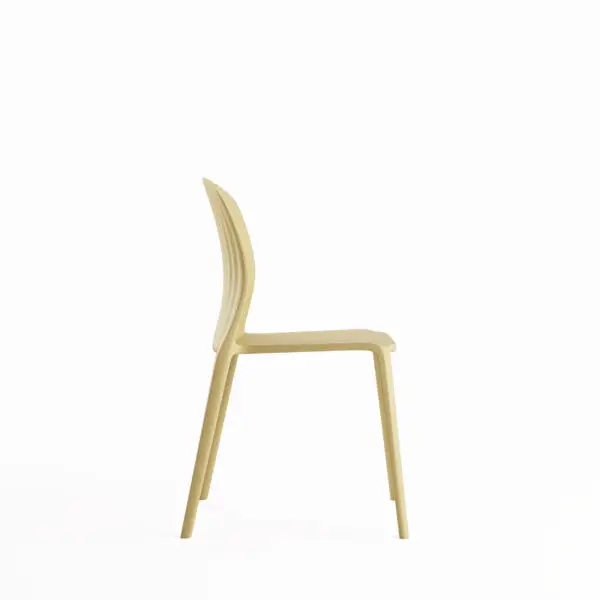 Side view of beige ribbed plastic dining chair